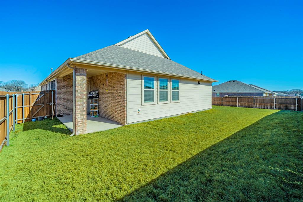 1240 Almond Road Azle, TX 76020 - Photo 21 of 26 a view of a house with backyard