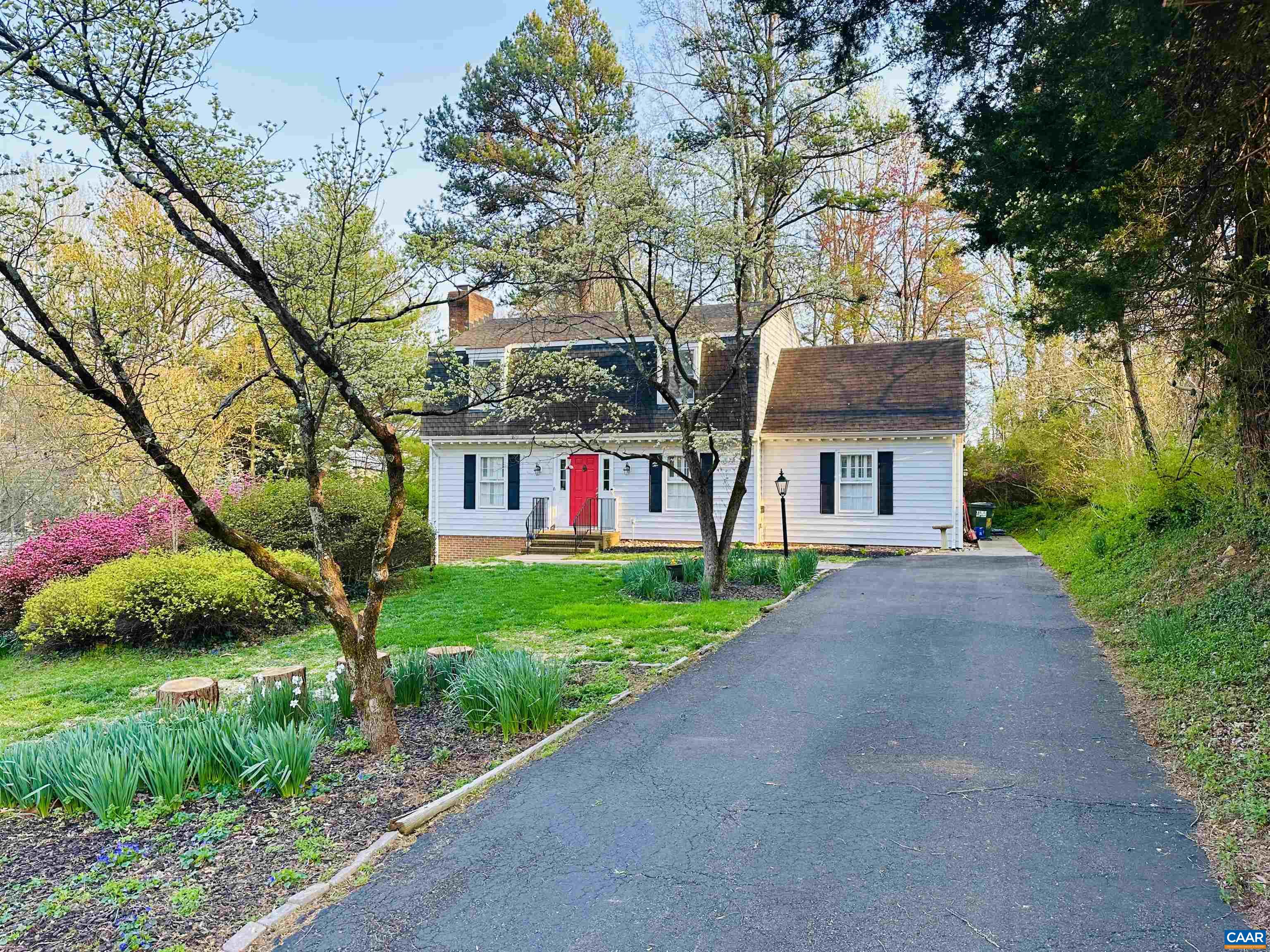 2403 Bennington Road Charlottesville, VA 22901 - Photo 1 of 31 a front view of a house with a yard and a tree