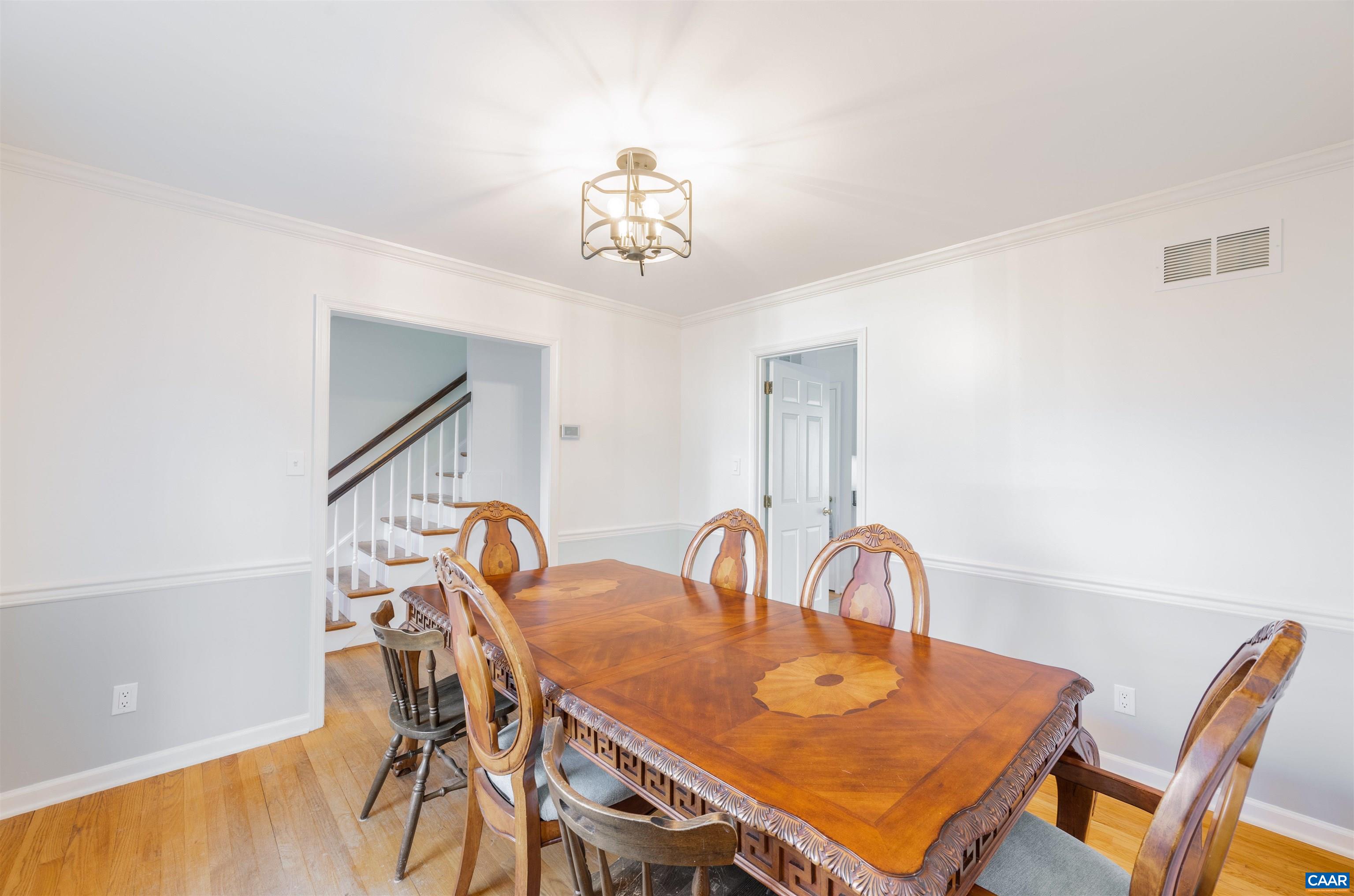 2403 Bennington Road Charlottesville, VA 22901 - Photo 4 of 31 a view of a dining room with furniture and chandelier