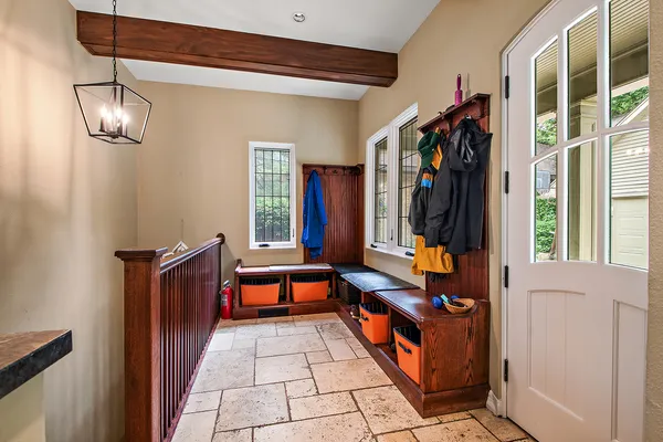 a living room with furniture and painting on the wall