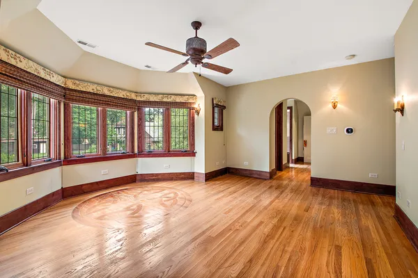 a room with wooden floor and furniture