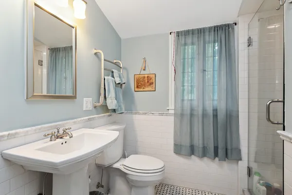 a bathroom with a sink toilet and vanity