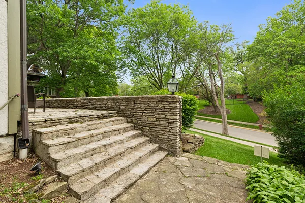 a view of a house with backyard porch and sitting area