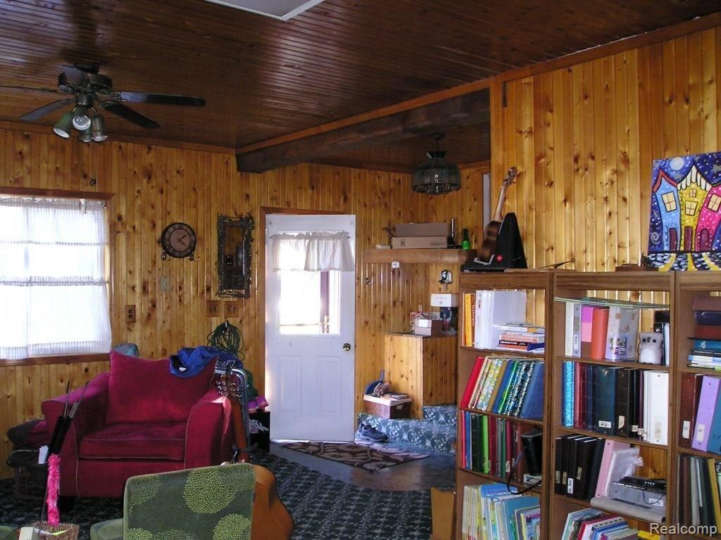 130 West Capac Road Imlay City, MI 48444 - Photo 16 of 20 Family room is L-shaped. Entry door.