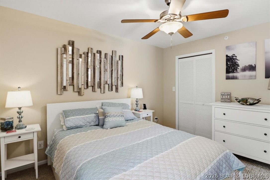158 Willow Ridge Point, Unit 3C Lake Ozark, MO 65049 - Photo 11 of 25 Bedroom and laundry closet w/stackable washer/drye