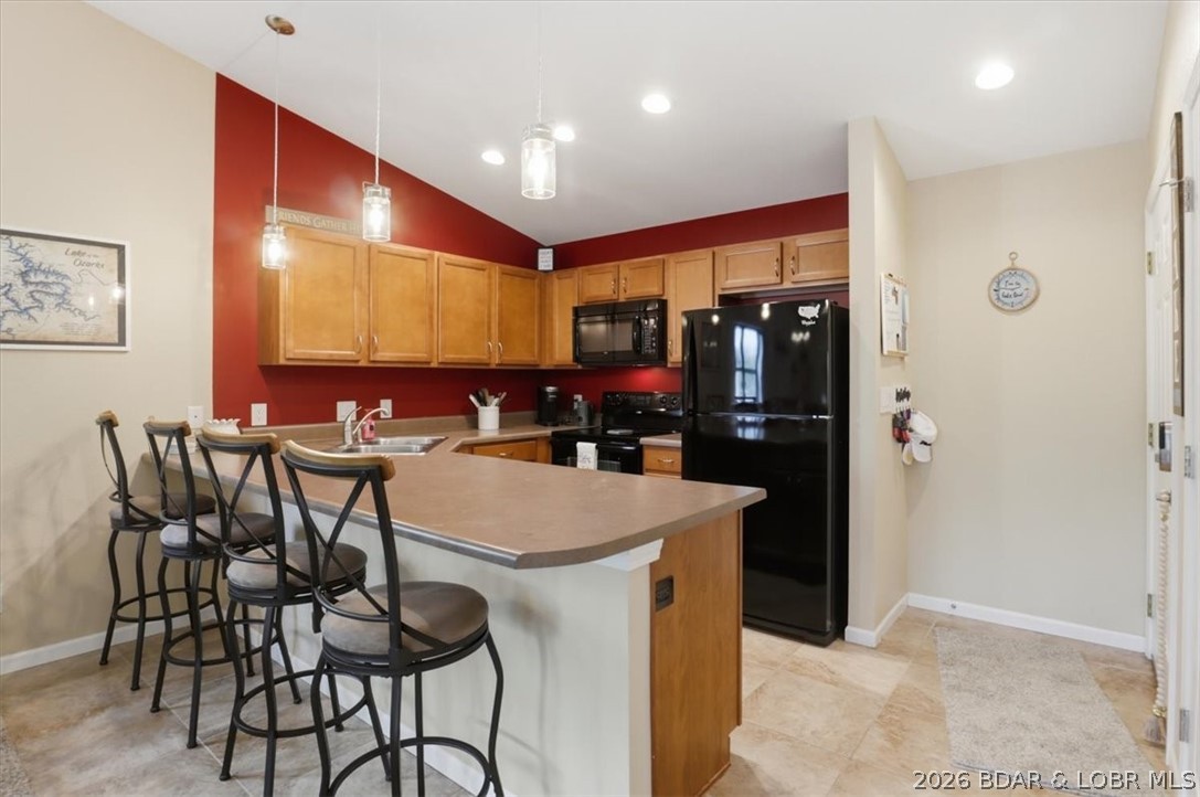 158 Willow Ridge Point, Unit 3C Lake Ozark, MO 65049 - Photo 3 of 25 Bar seating and kitchen