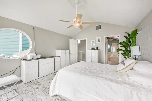 a roof deck with table and chairs