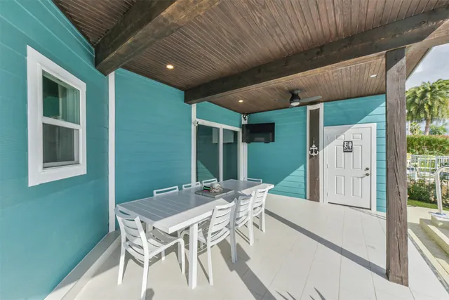 a view of a swimming pool with a patio