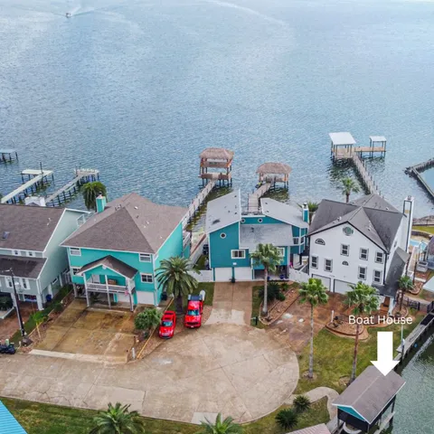 a living room with furniture large window and a potted plant