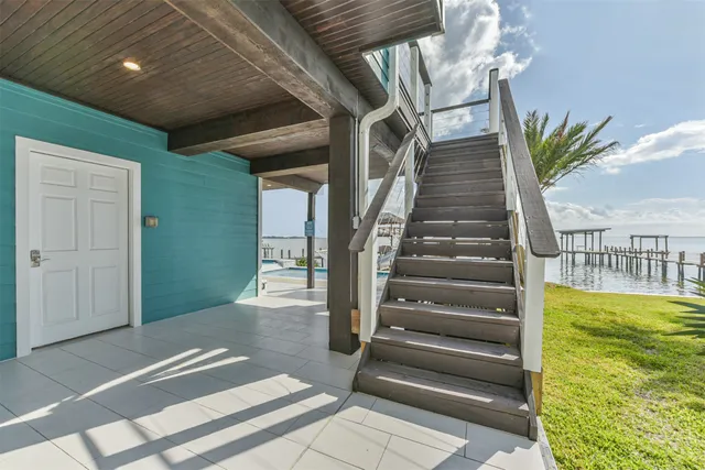 a swimming pool with outdoor seating and yard