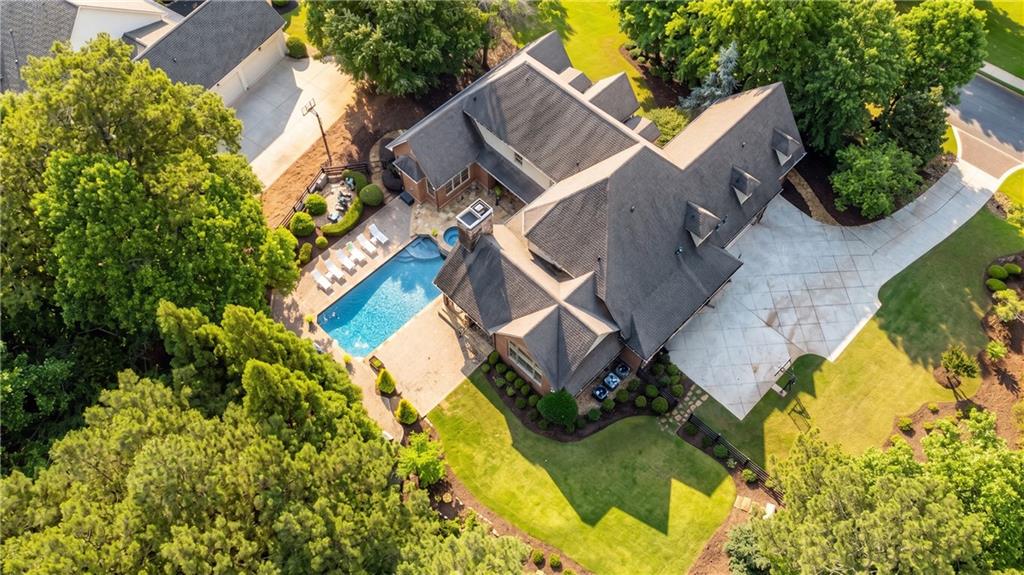 13942 Tree Loft Road Milton, GA 30004 - Photo 89 of 102 an aerial view of a house with a yard and garden