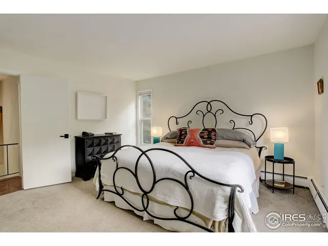 a bedroom with a bed and a table