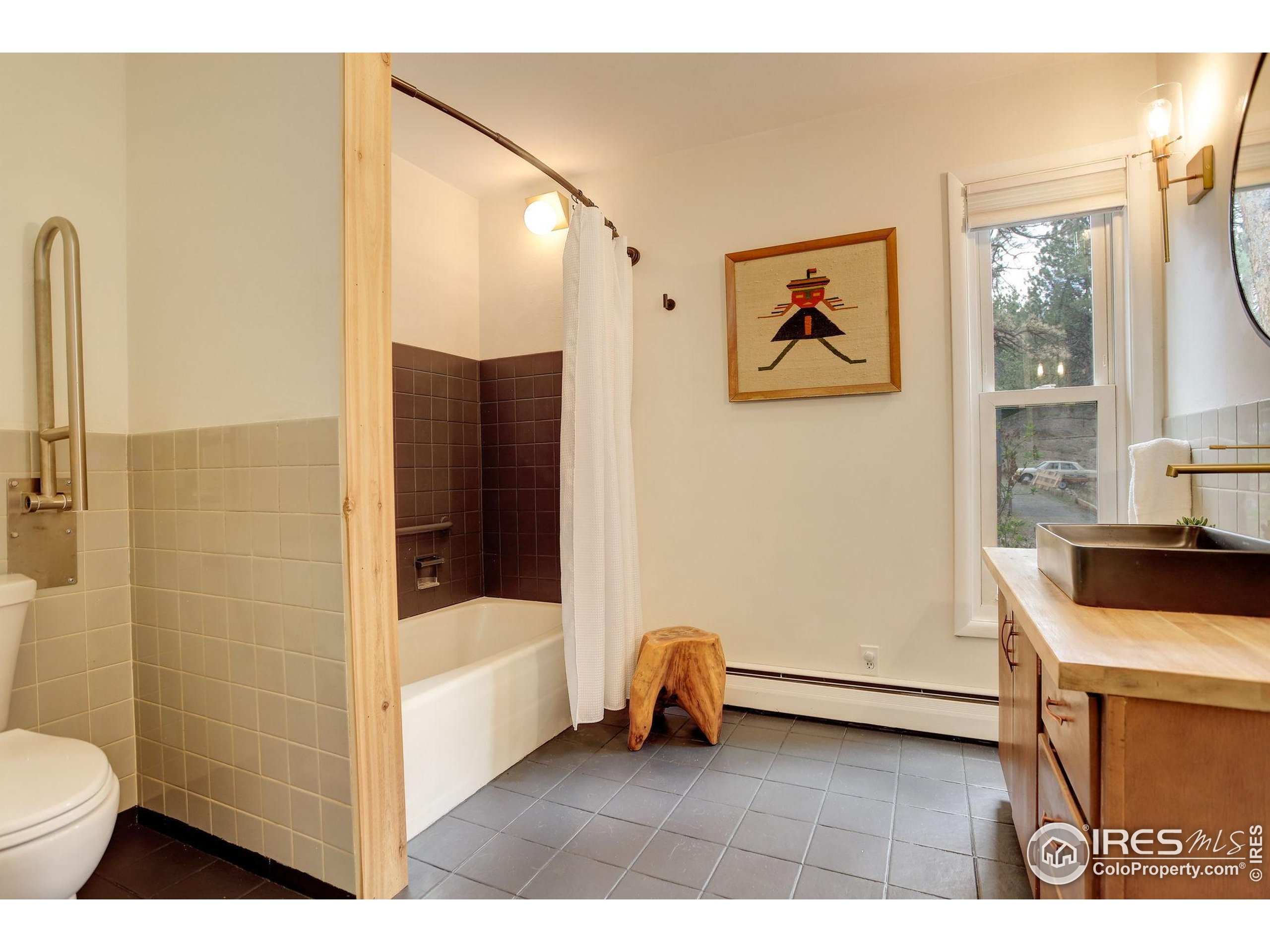 4 Porphyry View Jamestown, CO 80455 - Photo 17 of 36 a bathroom with a sink a toilet and shower