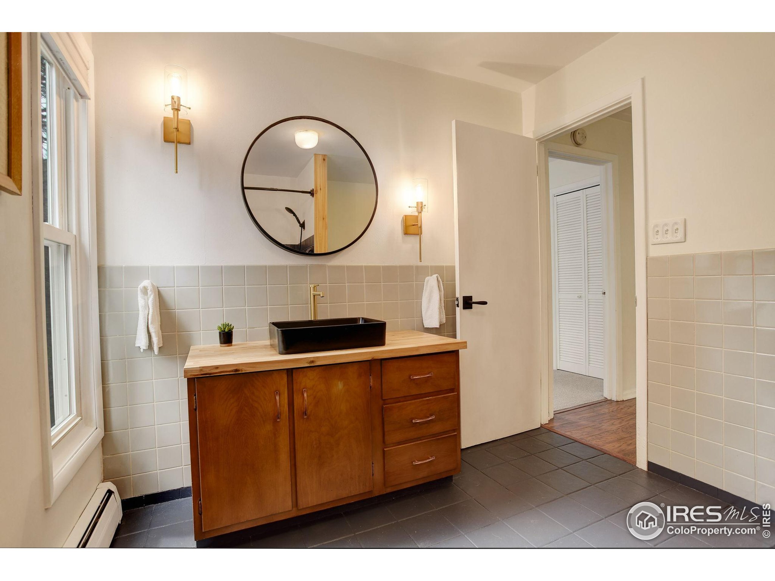 4 Porphyry View Jamestown, CO 80455 - Photo 18 of 36 a view of a kitchen with cabinets and a wooden floor