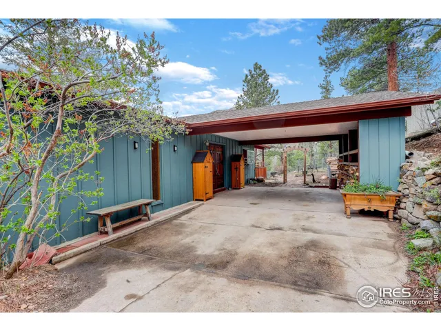 a view of the house with outdoor space and sitting area