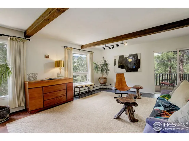 a bed room with furniture and a window