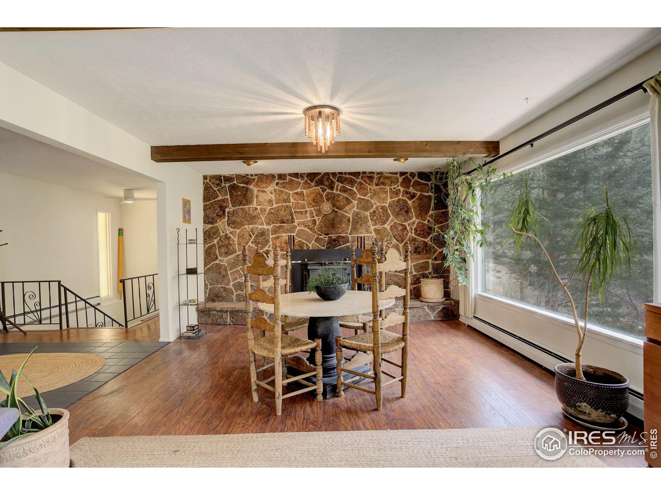 4 Porphyry View Jamestown, CO 80455 - Photo 7 of 36 a view of a dining room with furniture and wooden floor