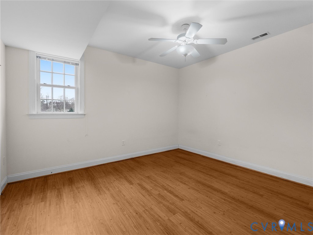 14335 Lander Road Midlothian, VA 23113 - Photo 58 of 70 wooden floor in an empty room with a window
