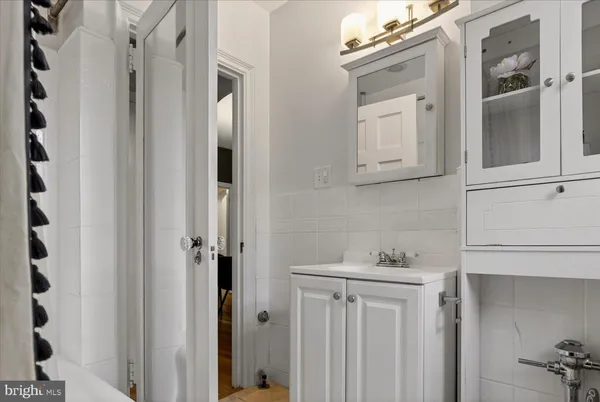 a view of a dining room with furniture and a chandelier