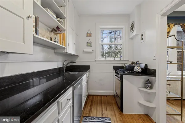 a kitchen with a sink and refrigerator