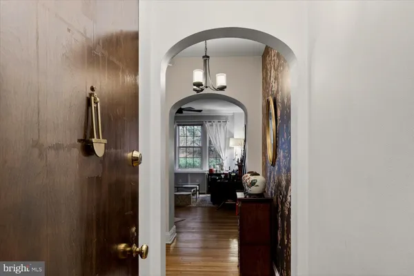 a view of an entryway with wooden floor
