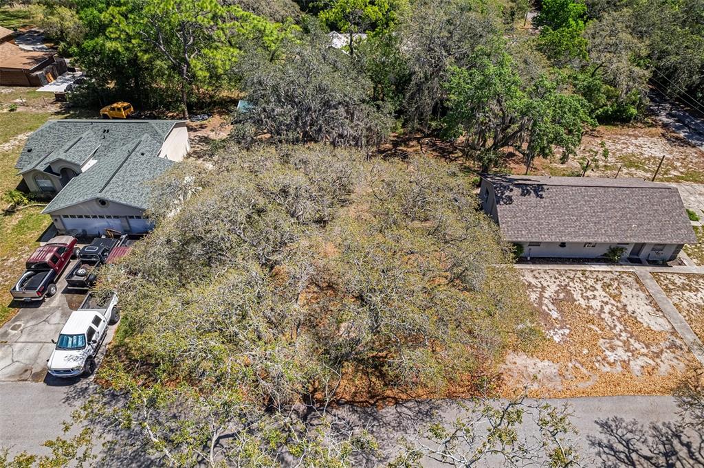 an aerial view of residential house with parking space