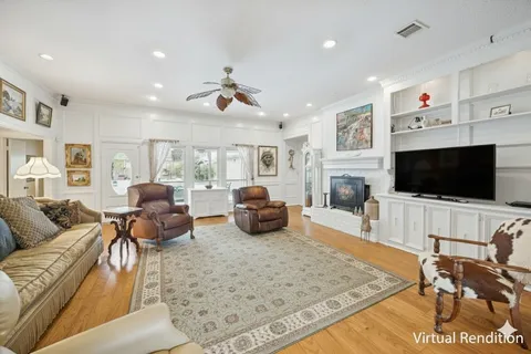 a living room with furniture kitchen view and a large window