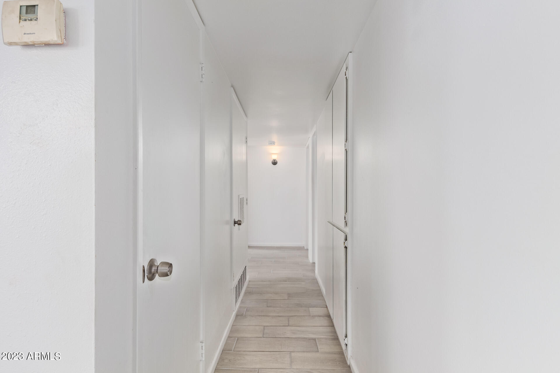 6532 West Granada Road Phoenix, AZ 85035 - Photo 13 of 31 a view of a hallway with wooden floor