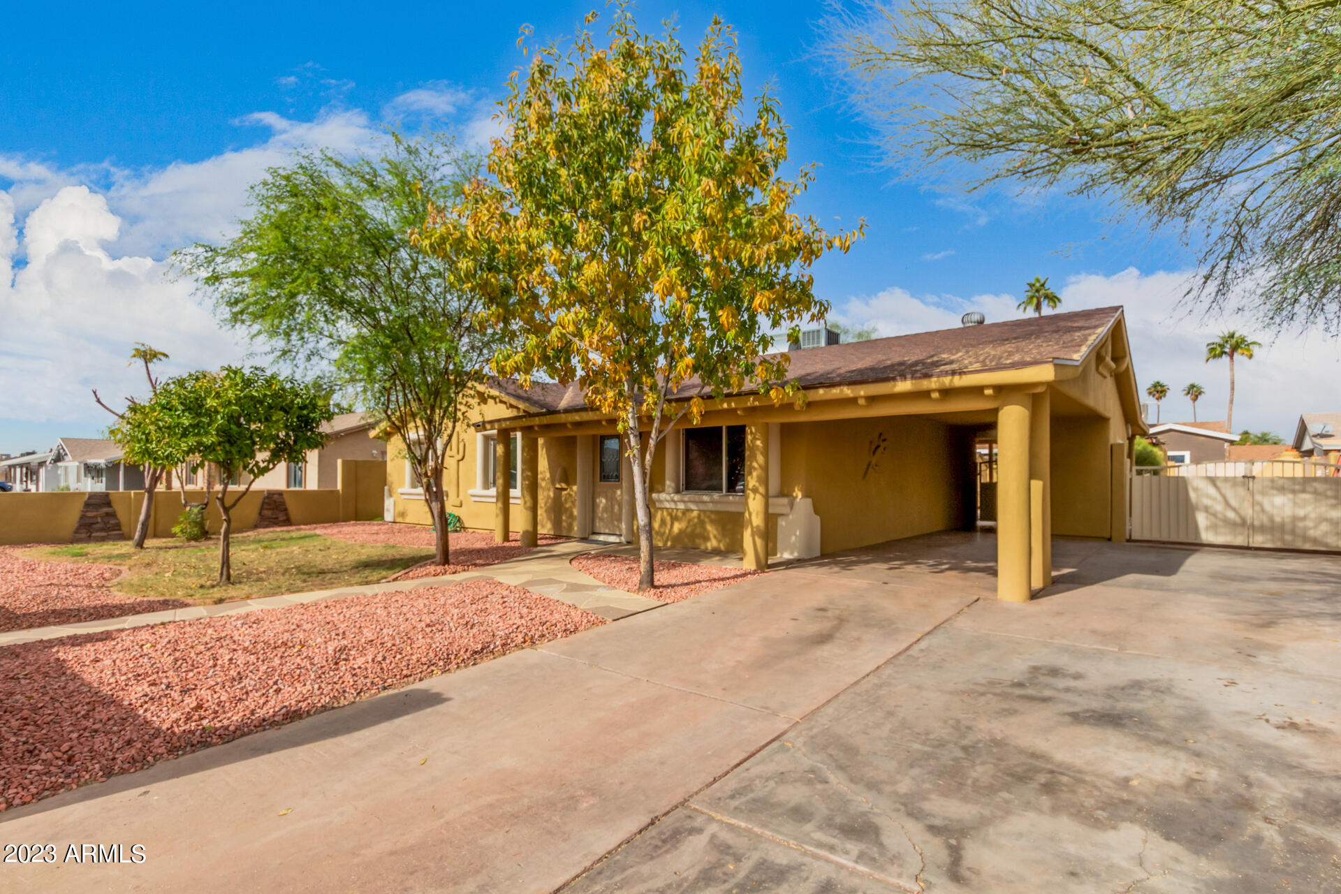 6532 West Granada Road Phoenix, AZ 85035 - Photo 3 of 31 a front view of a house with a yard and garage