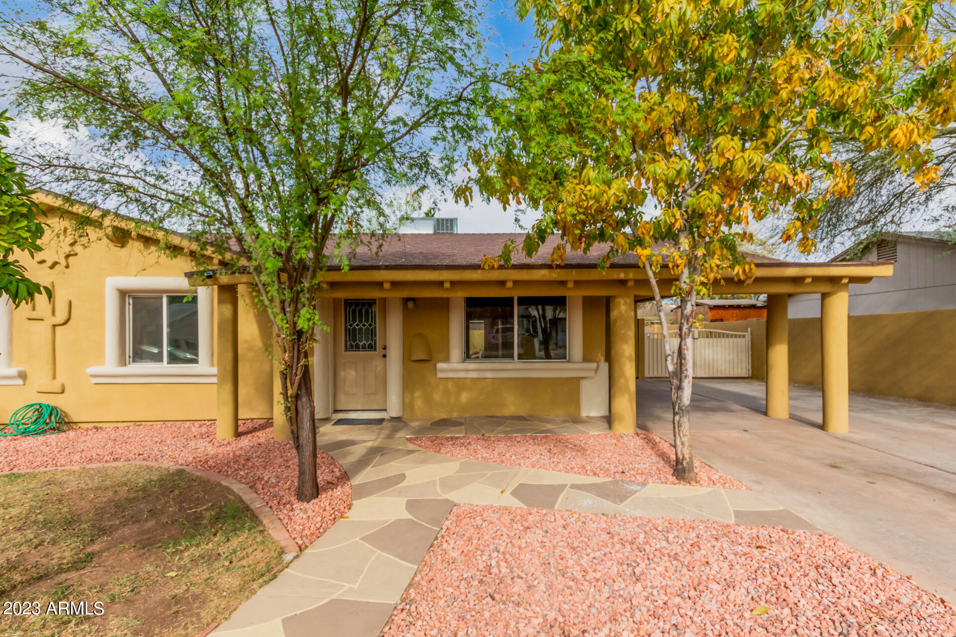 6532 West Granada Road Phoenix, AZ 85035 - Photo 4 of 31 a front view of a house with a tree in front
