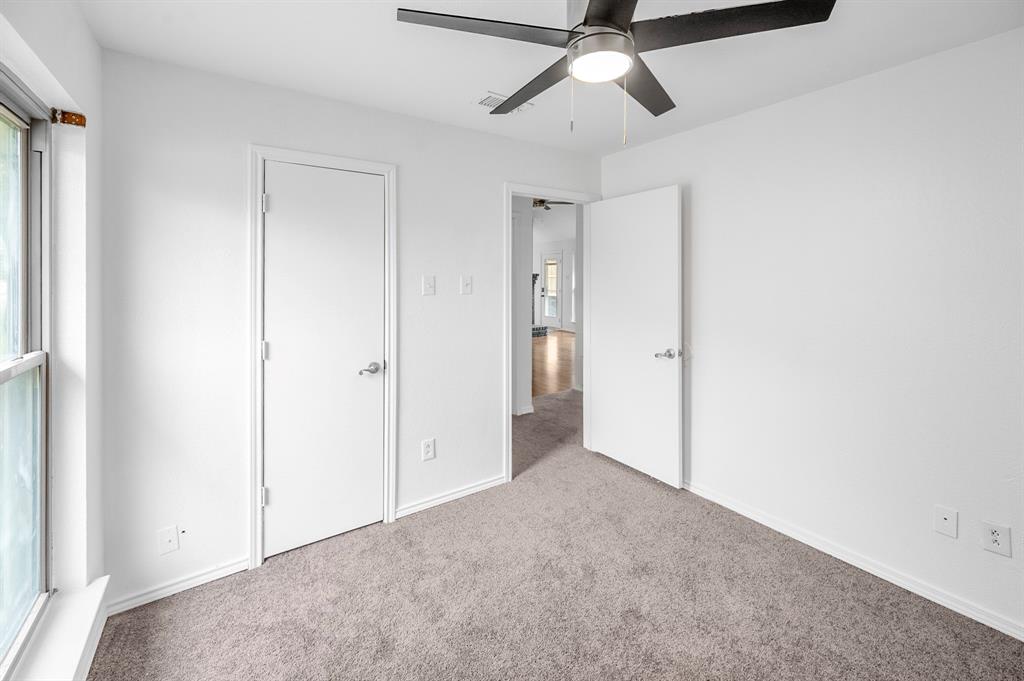 2218 Fuqua Road Rowlett, TX 75088 - Photo 18 of 30 an empty room with closet and a ceiling fan