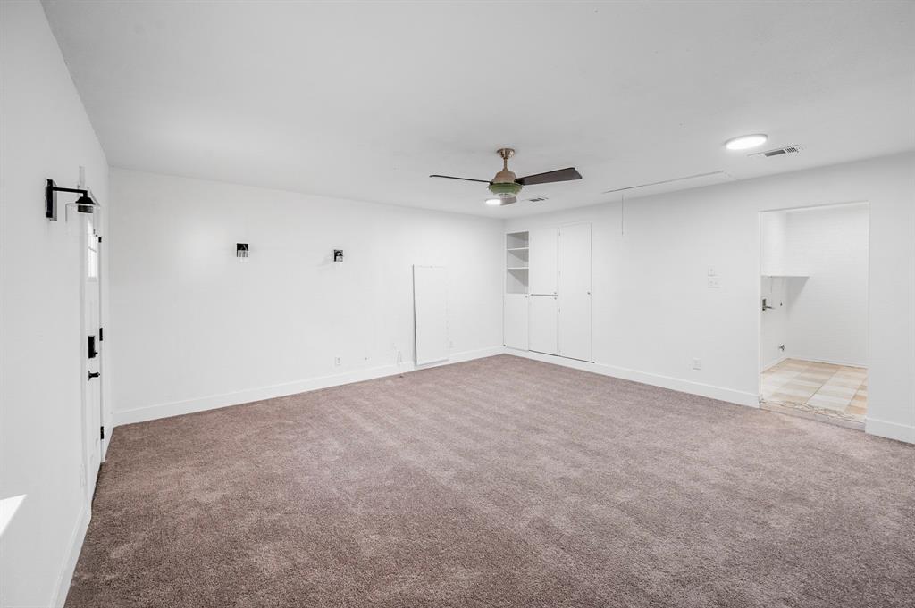 2218 Fuqua Road Rowlett, TX 75088 - Photo 25 of 30 a view of a livingroom with a ceiling fan and window