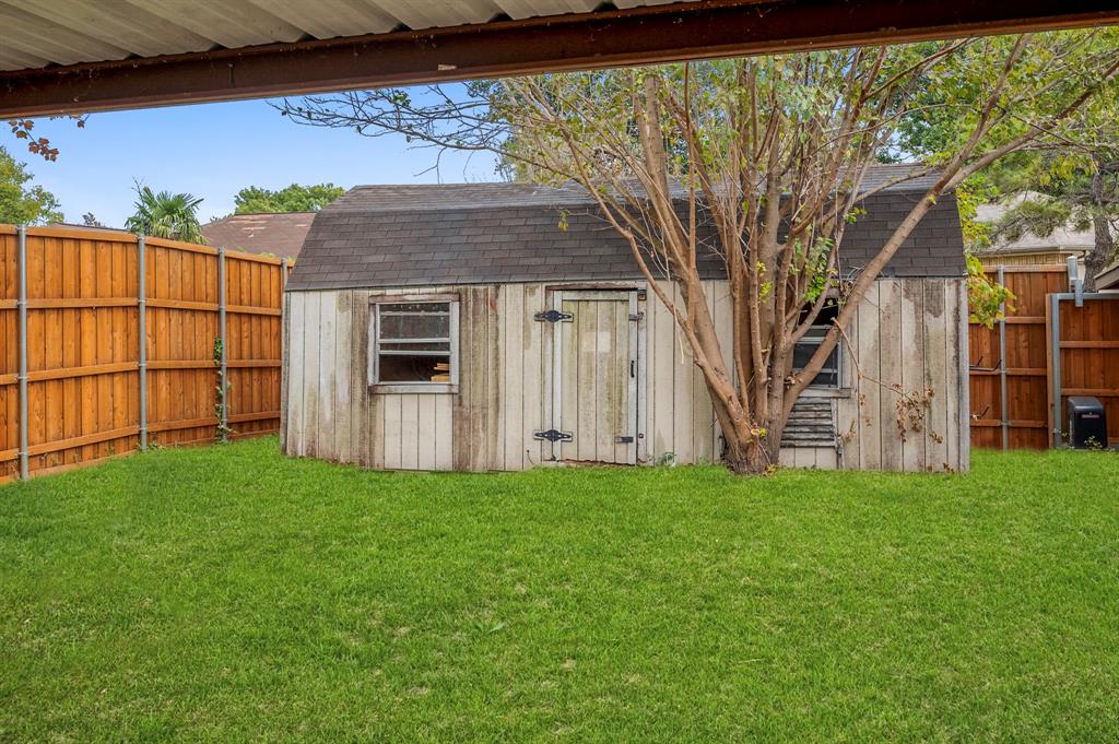 2218 Fuqua Road Rowlett, TX 75088 - Photo 27 of 30 a view of a back yard of the house