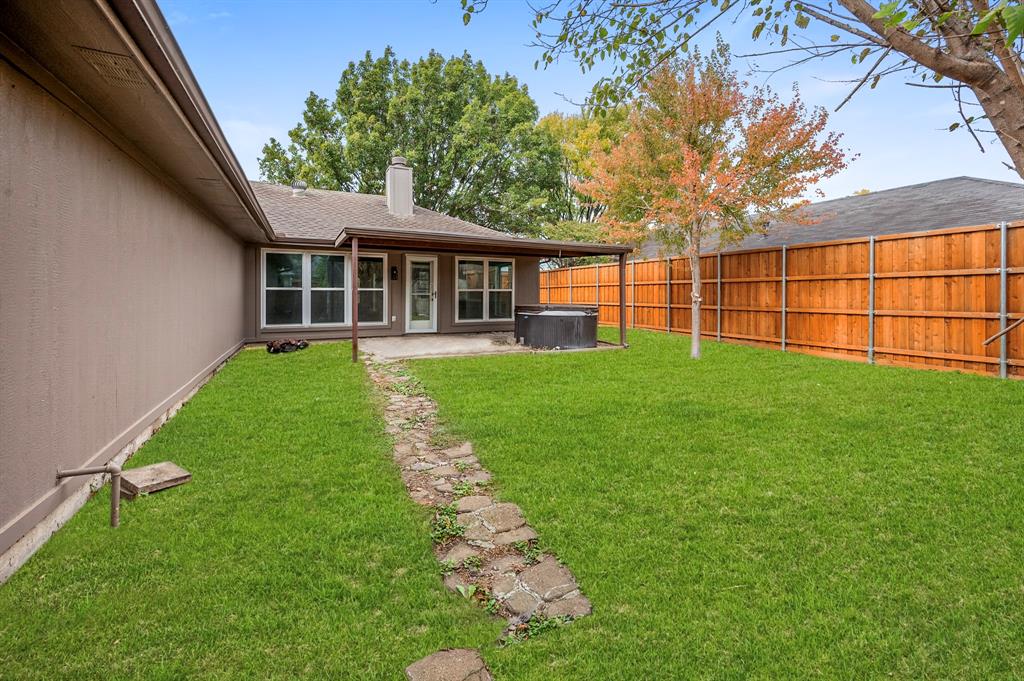 2218 Fuqua Road Rowlett, TX 75088 - Photo 30 of 30 a view of a house with a yard
