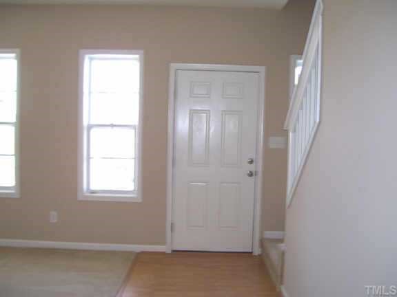 6823 Spanglers Spring Way Raleigh, NC 27610 - Photo 5 of 10 an empty room with windows and closet
