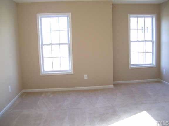 6823 Spanglers Spring Way Raleigh, NC 27610 - Photo 10 of 10 an empty room with windows