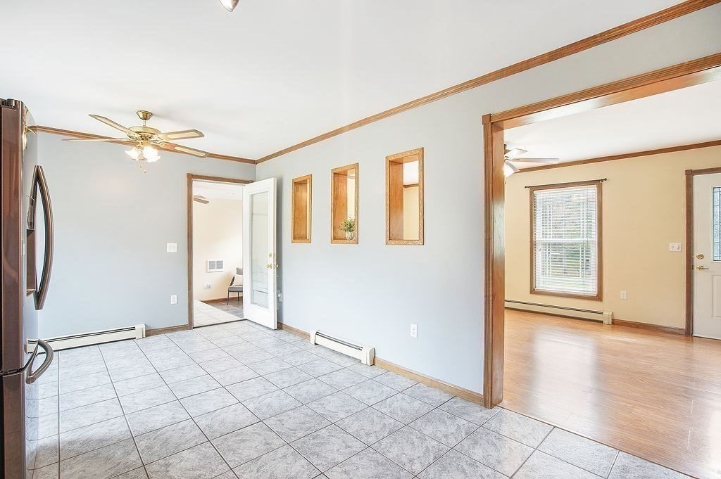 113 Batchelor Street Granby, MA 01033 - Photo 11 of 37 a view of empty room with wooden floor and fan