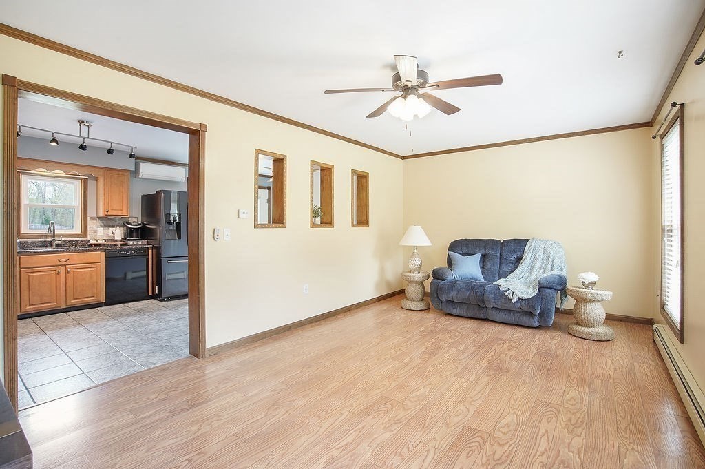113 Batchelor Street Granby, MA 01033 - Photo 12 of 37 a living room with furniture and kitchen view