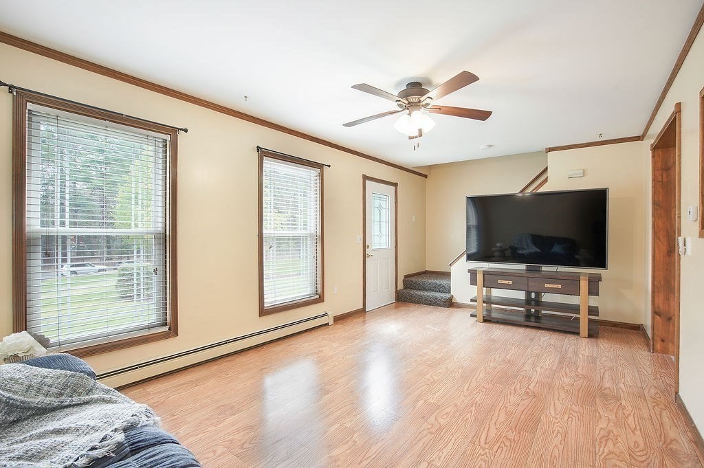 113 Batchelor Street Granby, MA 01033 - Photo 13 of 37 a living room with furniture and a flat screen tv