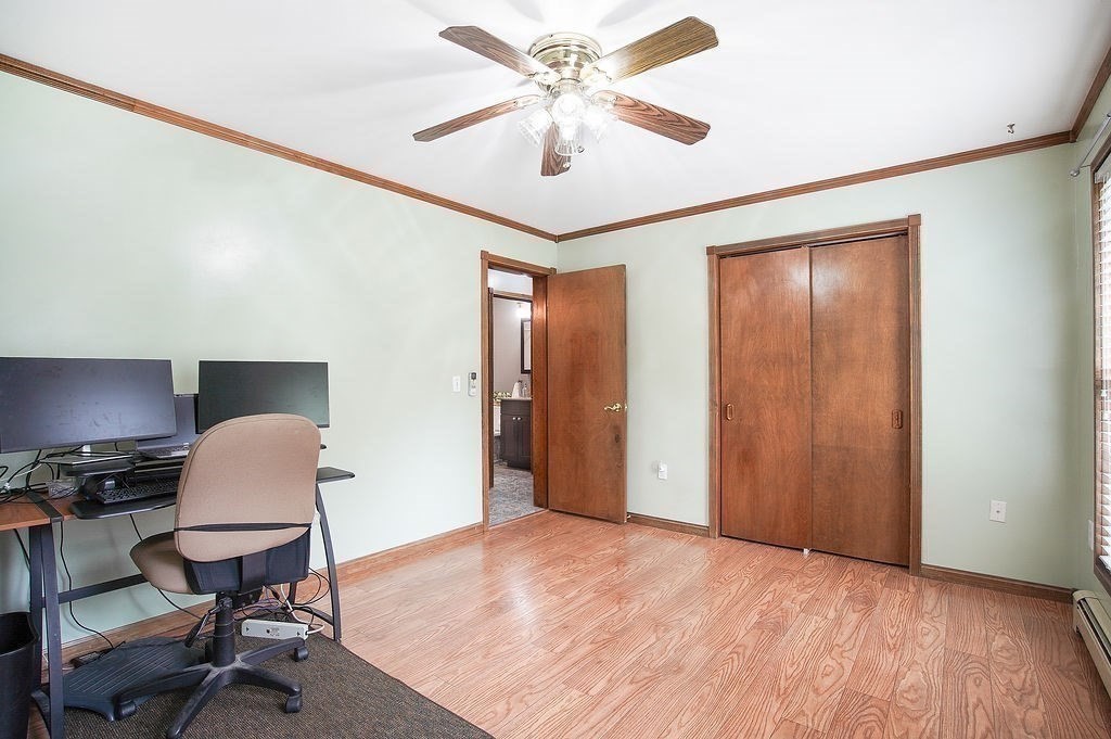 113 Batchelor Street Granby, MA 01033 - Photo 15 of 37 a workspace with wooden floor and a window