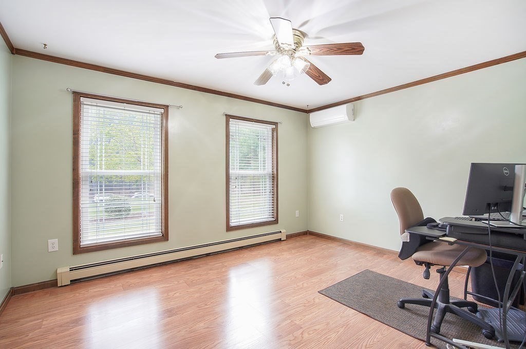 113 Batchelor Street Granby, MA 01033 - Photo 16 of 37 a view of workspace with wooden floor windows