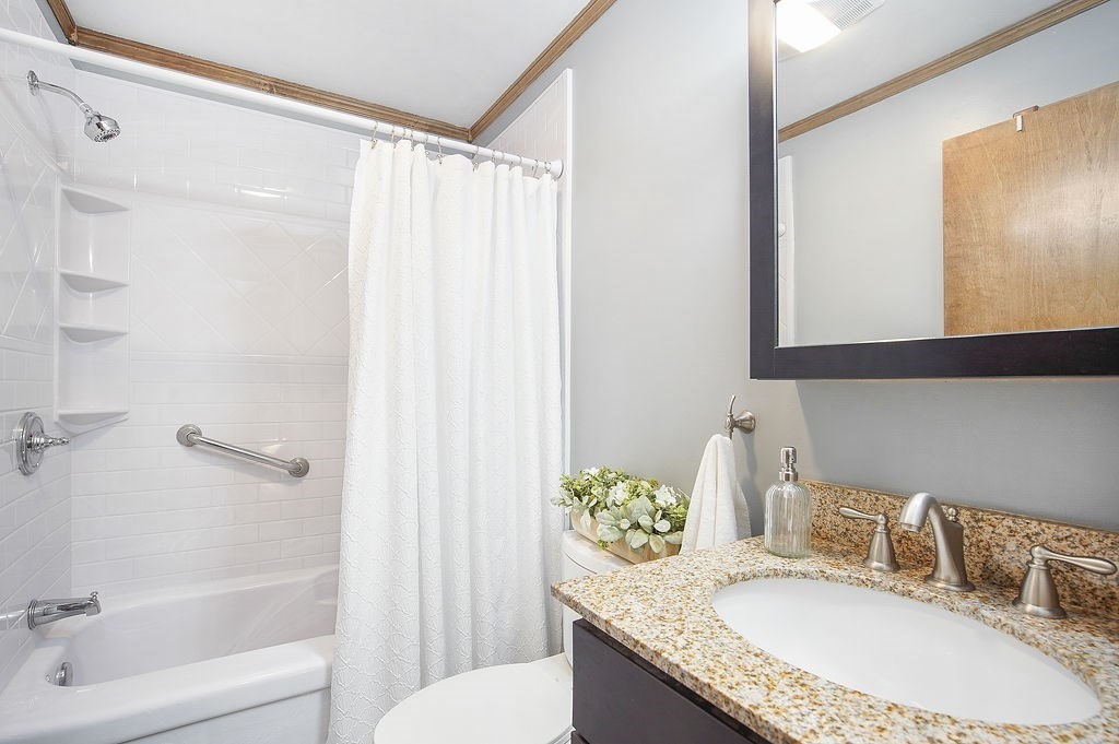 113 Batchelor Street Granby, MA 01033 - Photo 19 of 37 a bathroom with a granite countertop sink a toilet and shower