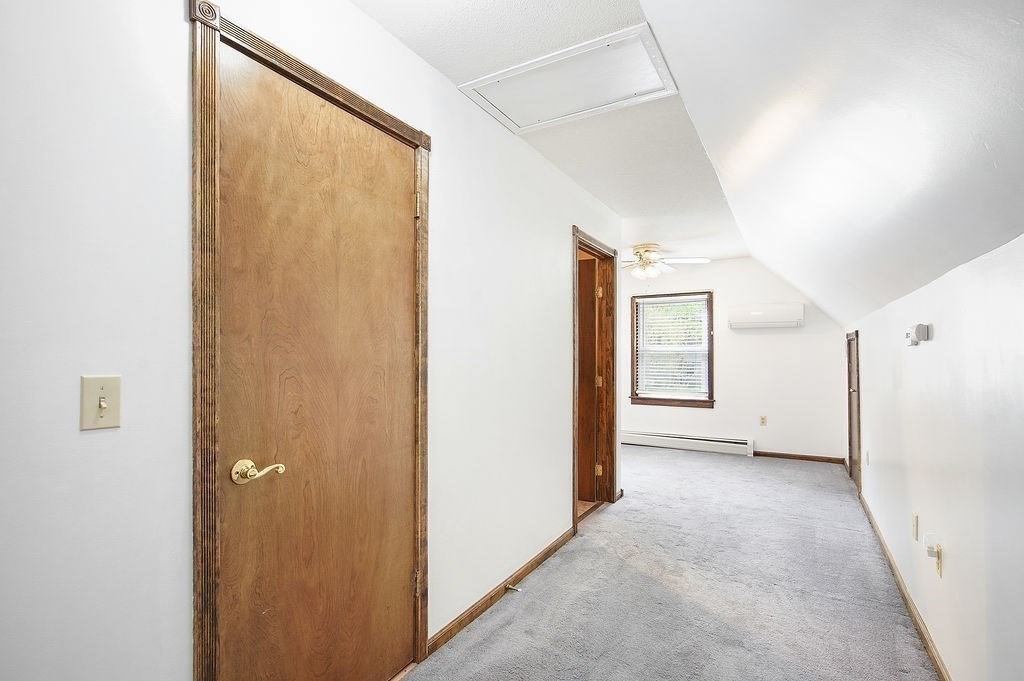 113 Batchelor Street Granby, MA 01033 - Photo 22 of 37 a view of a big room with closet and windows