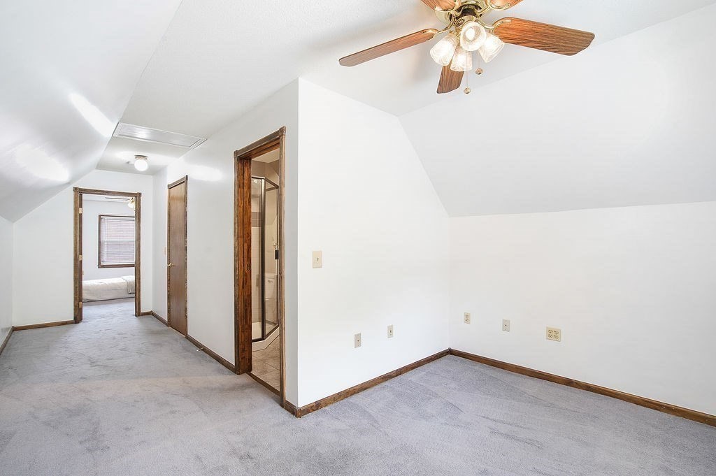 113 Batchelor Street Granby, MA 01033 - Photo 23 of 37 an empty room with a chandelier fan and closet