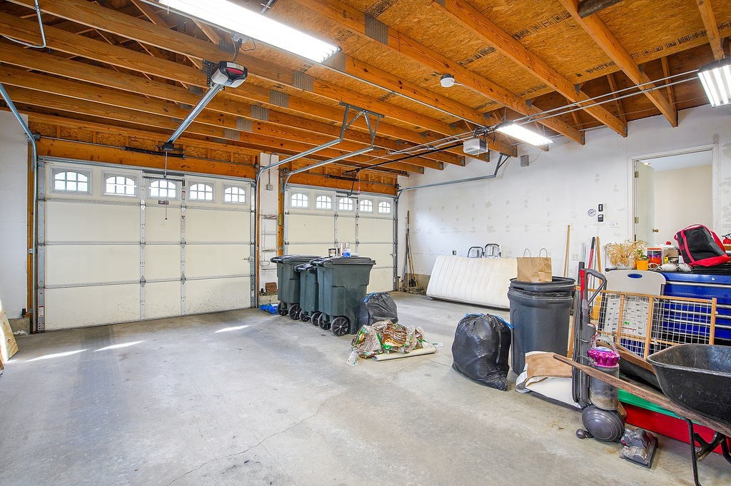 113 Batchelor Street Granby, MA 01033 - Photo 28 of 37 a view of a storage room with racks dryer and washer