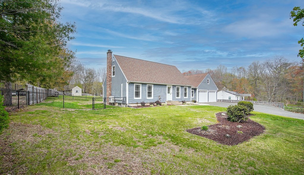 113 Batchelor Street Granby, MA 01033 - Photo 36 of 37 a view of a big house with a big yard potted plants and large tree
