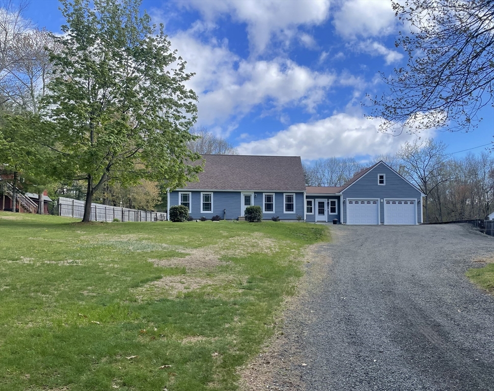 113 Batchelor Street Granby, MA 01033 - Photo 37 of 37 a view of a big house with a big yard and large trees