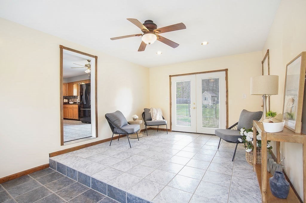 113 Batchelor Street Granby, MA 01033 - Photo 5 of 37 a living room with furniture and floor to ceiling windows