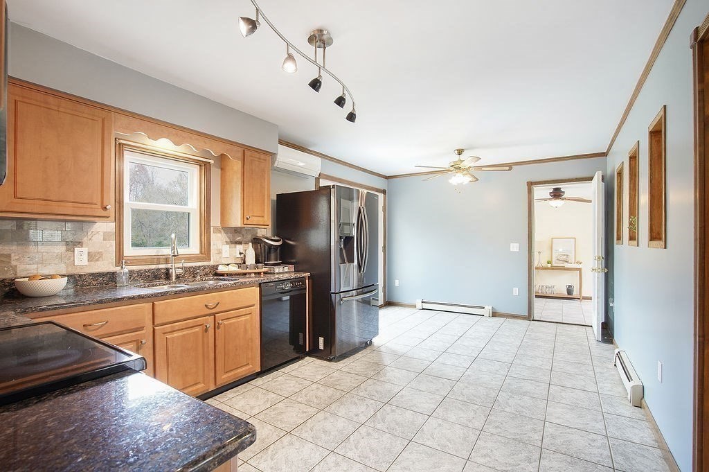 113 Batchelor Street Granby, MA 01033 - Photo 6 of 37 a kitchen with stainless steel appliances granite countertop a refrigerator and a sink