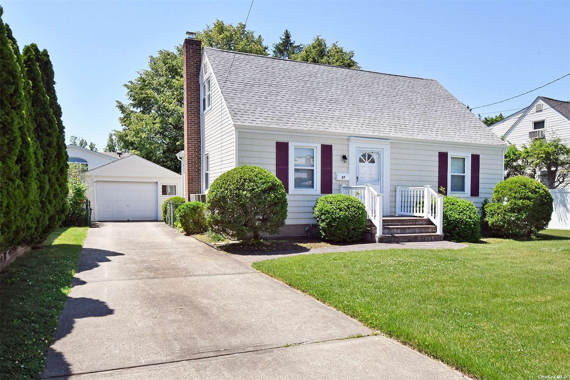 27 Beverly Road Bethpage, NY 11714 - Photo 1 of 1 a front view of house with yard and green space